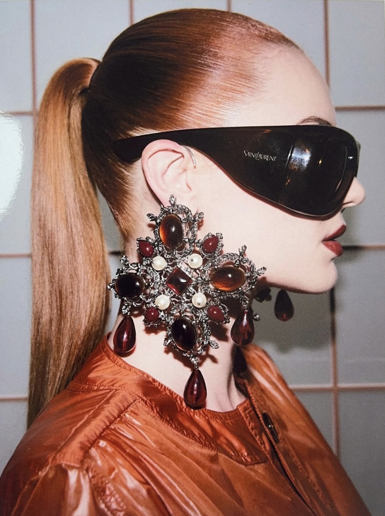 Red fashion portrait with oversized jewellery